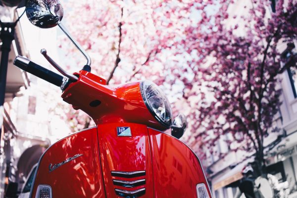 selective-focus-photography-of-red-motor-scooter-1528977